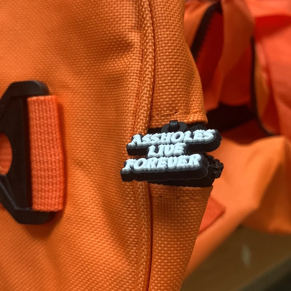 Assholes live forever Linda finegold duffel bag in orange